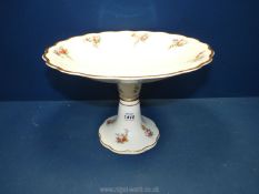 A pretty floral comport with sprays of flower to the rim and base, 11 1/2" diameter x 8" high.