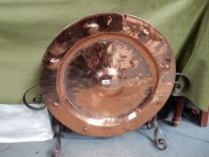 A beaten copper fire guard, 30'' wide x 25 1/2'' tall overall.