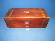 A Mahogany Writing slope with brass banding to corners and blank plaque to lid,