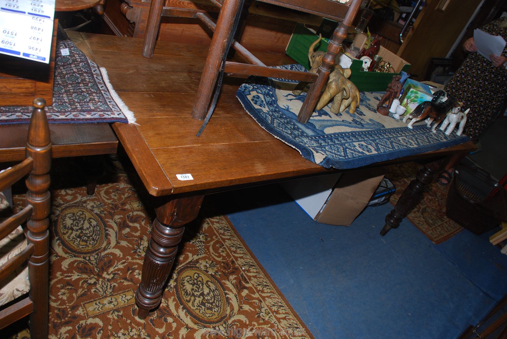 An unusual Oak dining Table having a six-plank cleated top, the base with turned and reeded legs,