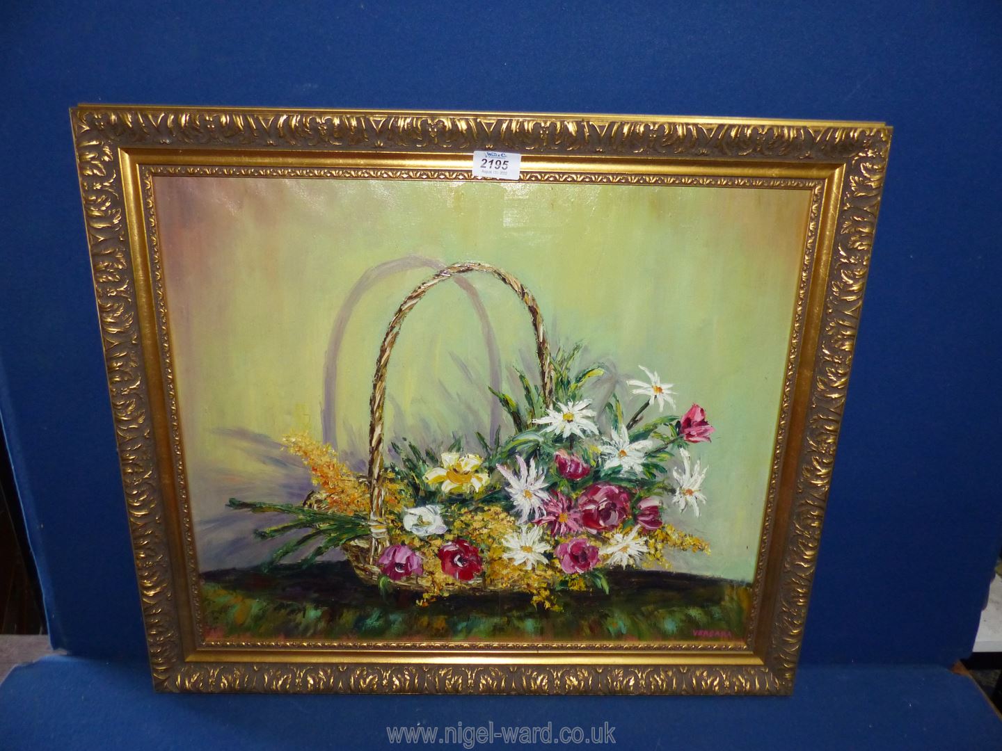 An ornate framed Oil on canvas depicting a basket of flowers, signed lower right Vergara,