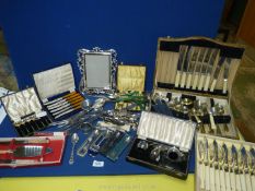 A quantity of boxed cutlery sets, coffee spoons, bone handled knives and forks, condiment set,