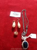A silver mourning locket (stamped 925) on chain, pair of 9ct gold dropper earrings and one odd stud,