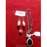 A silver mourning locket (stamped 925) on chain, pair of 9ct gold dropper earrings and one odd stud,