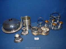 A quantity of EPNS items including egg cup stand with spoons,