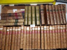 A quantity of leather bound books to include 24 volumes of Swift's works,