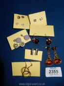 A quantity of various costume earrings.