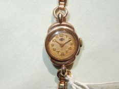 A Derrick lady's rolled gold expanding wristlet watch (running at time of inspection).