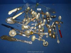 A small quantity of flatware including enamel souvenir spoons, fish servers,