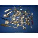 A small quantity of flatware including enamel souvenir spoons, fish servers,