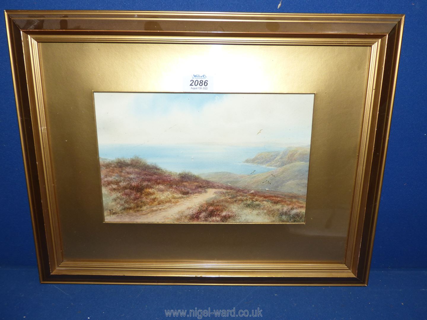 A framed and mounted watercolour depicting a coastal scene, signed lower left 'F. Parr'.