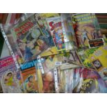 A quantity of comic magazines to include 'Secrets of the Unknown,' 'Mystery in Space,' 'Lassie,