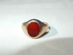 A lady's 9ct gold ring set with a bloodstone,