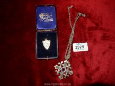 A Jerusalem sterling silver 980 Crucifix on chain and a yellow metal, shield shape locket.