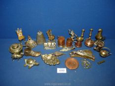 A quantity of brass miniatures including bells, rocking chair, door, knocker, old boot, snail,