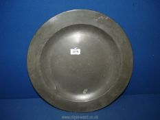 An 18th c. Pewter charger, with touchmarks to rear, 16'' diameter.