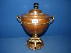 A copper lidded Samovar with brass tap and handles, 14" tall.