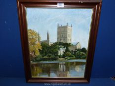 A framed oil on board depicting Tewkesbury Abbey (possibly),