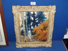 An ornate framed impasto oil on board depicting a lady walking along a woodland path,