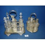 A six piece cruet on a plated stand (some bottles a/f) together with a four piece cruet.