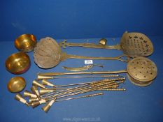 A small quantity of brass including candle snuffers, chestnut roaster, eastern decorated bowls etc.