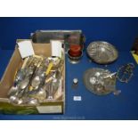 A quantity of plated cutlery including knives, forks, spoons, etc.