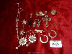 A quantity of silver ethnic style earrings, silver Tiger etc.