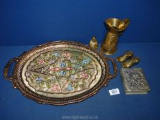 A colourful copper two handled tray, two brass boots, a brass bell, brass jug, etc.