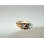 An 18ct gold gypsy style ring set with a single diamond, 3.5mm diamond approx. (4gms approx.