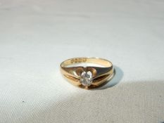 An 18ct gold gypsy style ring set with a single diamond, 3.5mm diamond approx. (4gms approx.