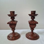 A pair of stylish William IV/early Victorian carved mahogany baluster form candlesticks,