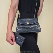 Chanel: a fine medium quilted leather flap bag with classic gilt metal and leather shoulder strap