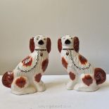 A pair of late Staffordshire style 'wally' dogs painted in brown and gold; 20th century;