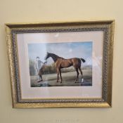 A decorative horse and jockey print 18" width x 15" high frame.