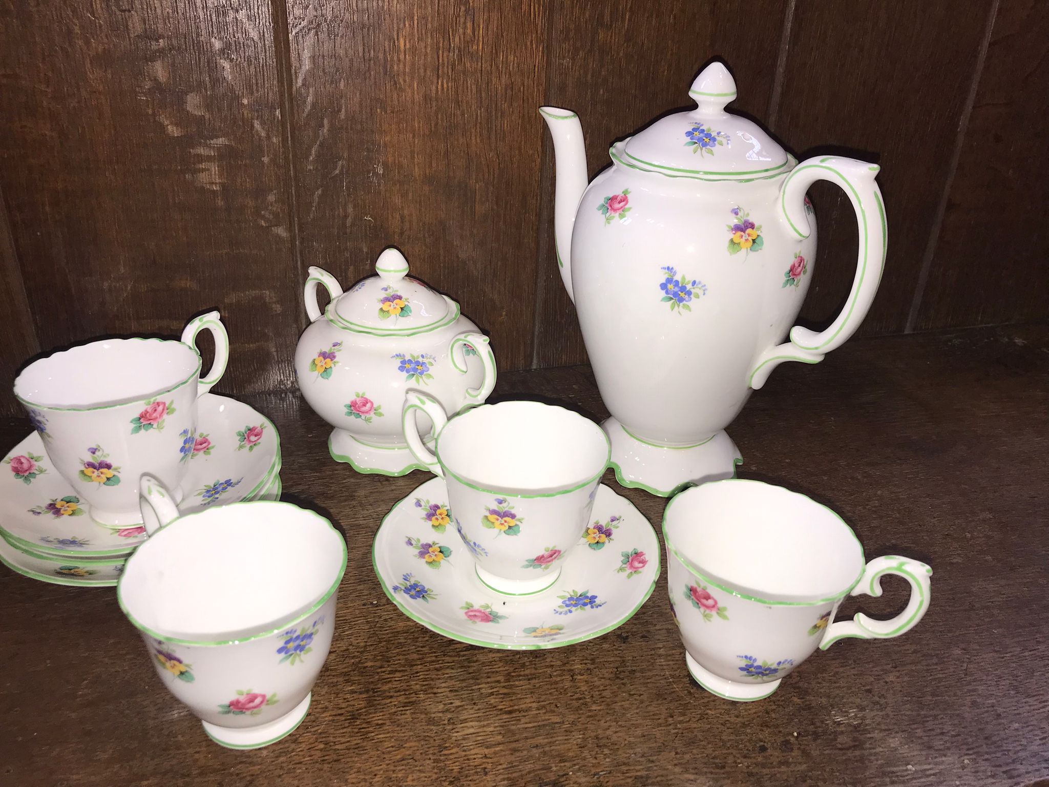 A Crown Staffordshire part Coffee set, with ground with floral sprays.