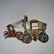 A delightful finely crafted vintage costume jewellery metal and enamel brooch formed as an 18th