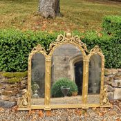 A large and impressive 19th century Venetian carved wood and gesso gilt triple plate mirror.