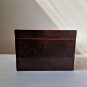 A George III flame Mahogany two compartment tea caddy,