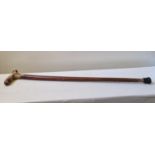 A characterful old country made walking stick carved from a single piece of wood,