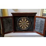 A very rare vintage ‘trompe l’oeil’ cased dart board,