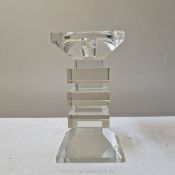 A heavy glass modernist candlestick of cubist design, 7'' high x 3 1/2'' wide.