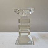 A heavy glass modernist candlestick of cubist design, 7'' high x 3 1/2'' wide.