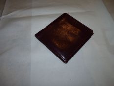 A burgundy wallet in fine calf skin wallet,