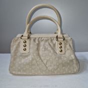 Louis Vuitton: a Cream Denim Mini Lin handbag,