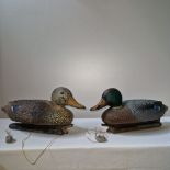 Two vintage plastic duck decoys both with original lead weights.