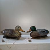 Two vintage plastic duck decoys both with original lead weights.