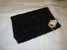 A vintage beaded clutch bag.