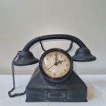 A novelty Clock in the shape of a vintage telephone (7 ins x 7 ins).