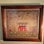 An impressive Georgian sampler in a good maple frame depicting Adam and Eve above with a farmhouse