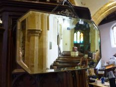 A large 1920's bevel plate mirror in ornate copper frame.